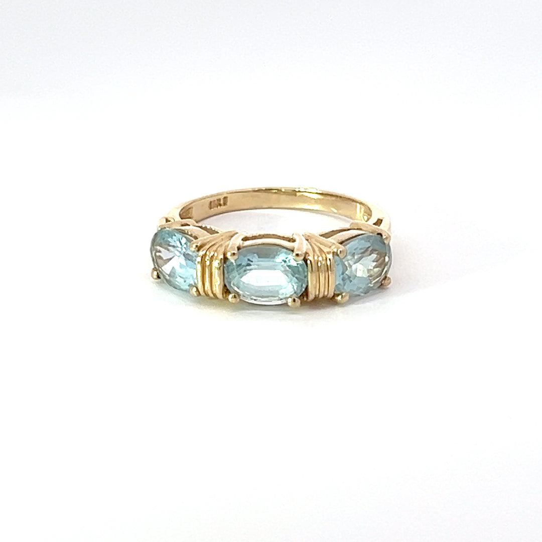 Blue Topaz and 14k Yellow Gold Three Stone Ring
