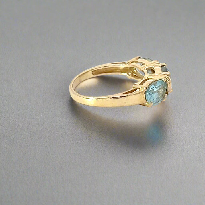 Blue Topaz and 14k Yellow Gold Three Stone Ring