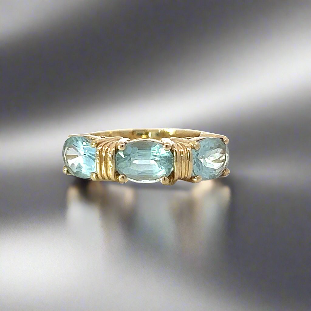 Blue Topaz and 14k Yellow Gold Three Stone Ring