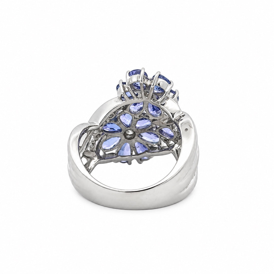 Estate tanzanite and diamond flower ring in 18K white gold, back view