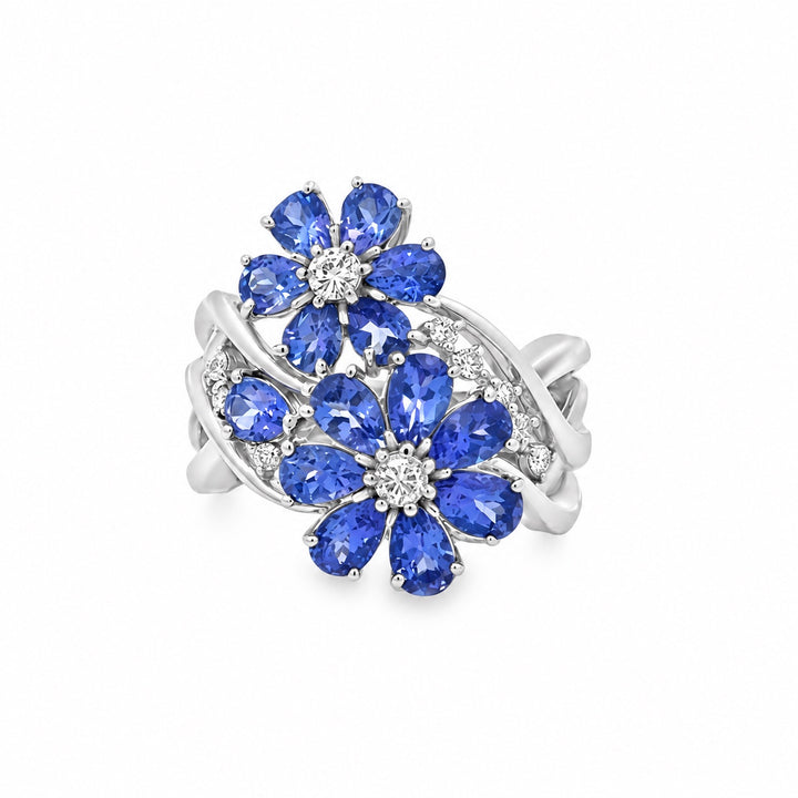 Estate tanzanite and diamond flower ring in 18K white gold, front view