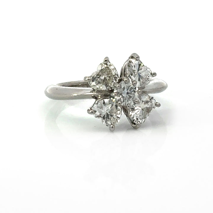 Three-quarter view of platinum heart-shaped diamond clover cluster ring