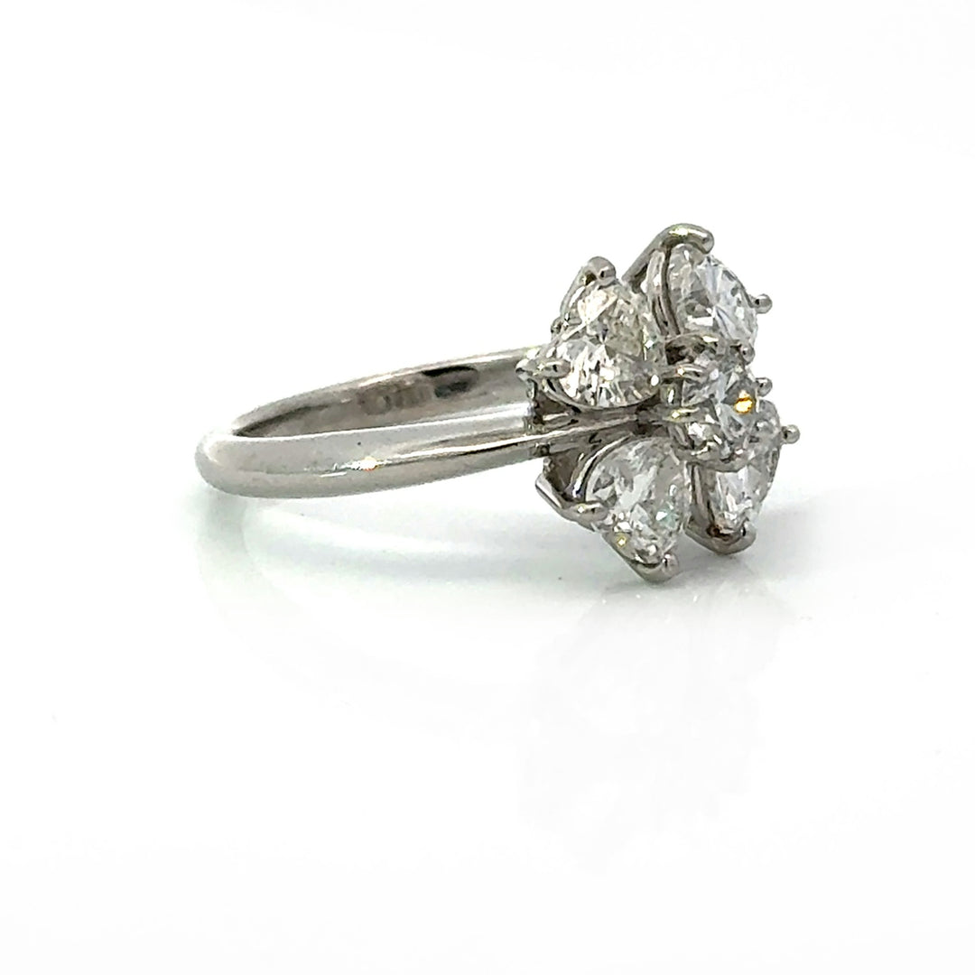 Side profile showing prong-set diamonds and platinum band
