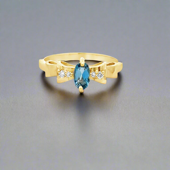 Oval Aquamarine, Diamond and 14K Yellow Gold Bow Ring