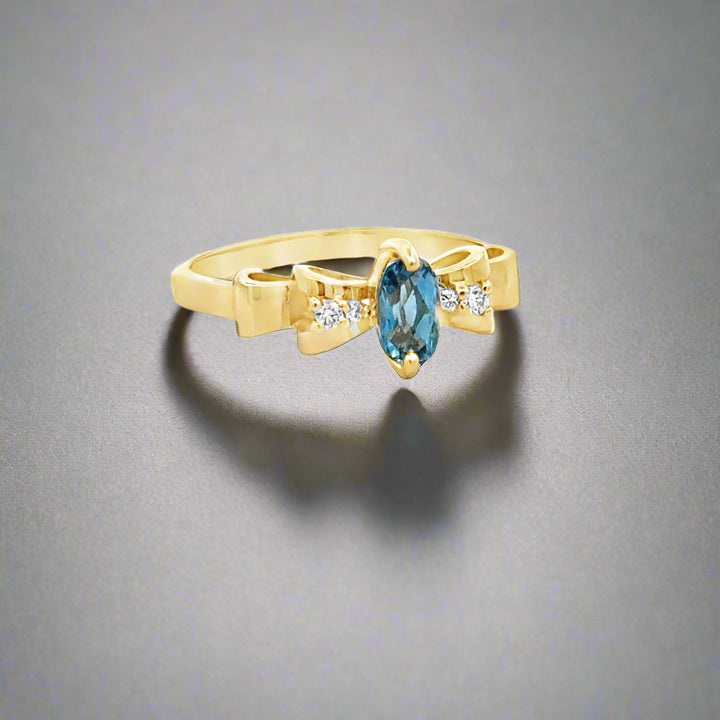 Oval Aquamarine, Diamond and 14K Yellow Gold Bow Ring