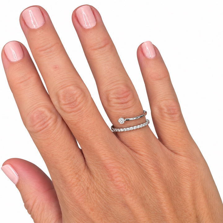 Vintage 14K white gold diamond bypass ring shown on hand