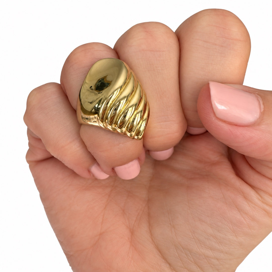 Vintage 14K yellow gold ribbed sculptural statement ring shown on hand